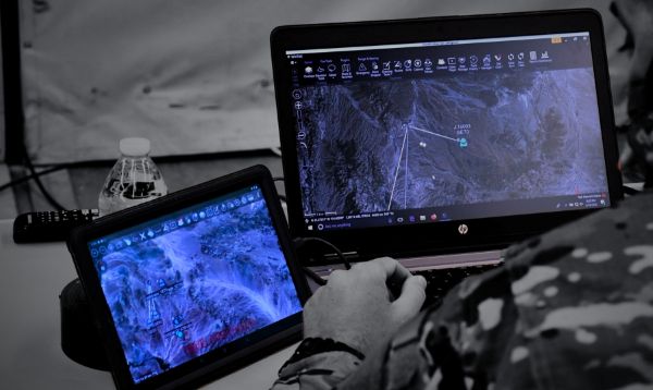 Decorative image of hands holding a controller with a map displayed on the screen