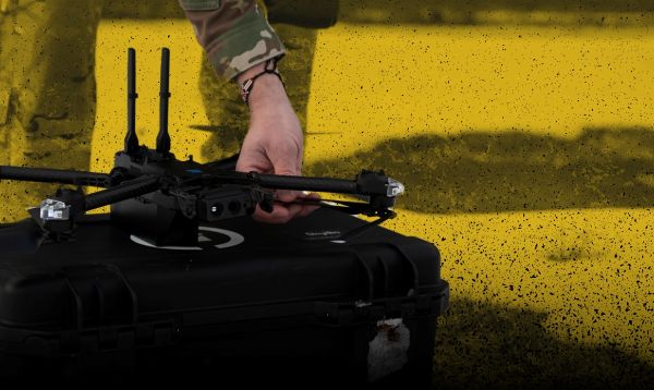 Decorative image of hand holding a drone