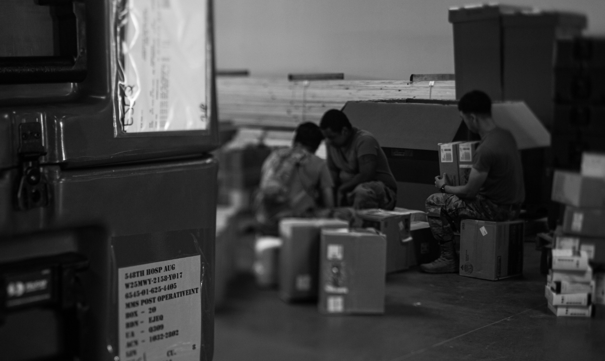 Decorative image of people sitting in a warehouse